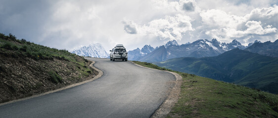 Driving off road car on the high altitude mountains