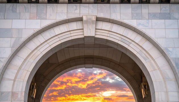 Stone Archway Framing a Dramatic and Colorful Sunset Sky.