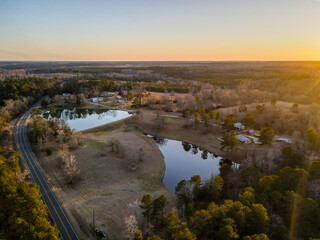 Aerial landscape rural forest winter sunset after Hurricane Helene in Newton County Georgia