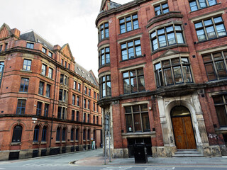 Historic red brick buildings on Waterloo street corner in Manchester, United Kingdom
