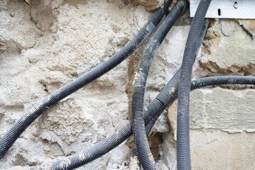 The plumbing work is currently in progress, showcasing exposed pipes and a bare floor in a bathroom renovation project