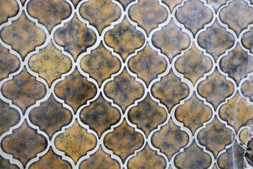 Stunningly beautifully patterned Moroccan tiles that showcase earthy tones along with intricate designs