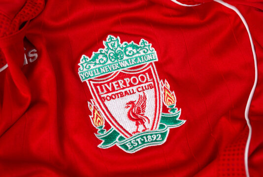 Kyiv, Ukraine - September 15, 2025: A close-up shot of the Liverpool Football Club crest on a classic red home jersey, featuring the iconic Liver bird and the club's motto.