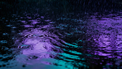 Raindrops on dark water surface at night creating ripples and circles. Abstract background with vibrant purple and turquoise neon light reflections. Moody, tranquil weather scene.