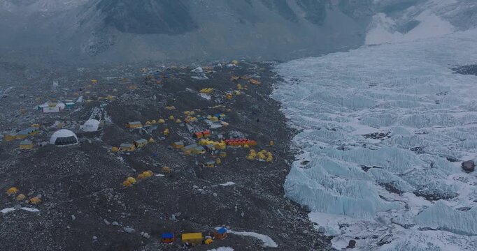 Drone view of Khumbu Glacier at Everest Base Camp, Sagarmatha, Nepal. Crowds of summit tents and high-altitude housing show climbing life, tourism growth, glacier melt challenges in fragile Himalayas