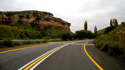 Landscape photo of a tar road and the mountain early morning on the way to Golden Gate