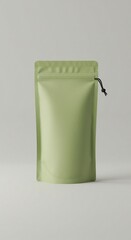 A light green, sealed pouch stands against a muted backdrop, its simplicity emphasizing clean lines and subtle textures, minimalist presentation.
