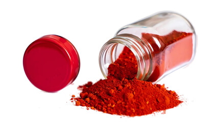Vibrant red powder spilled from a transparent jar on a black surface isolated on transparent...