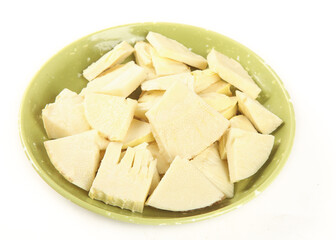 Fresh White Bamboo Shoots Sliced in Green Bowl Ready for Cooking