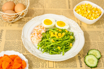 Gourmet Fresh Salad with Corn Kernels and Eggs on Newspaper Background - Healthy Food Concept