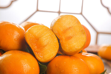 Fresh Cut Persimmons with Sweet Orange Flesh on Modern Kitchen Counter