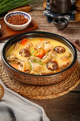 Finished Duck Stewing Soup with Mushrooms in Traditional Ceramic Bowl - Refreshing Asian Comfort Food