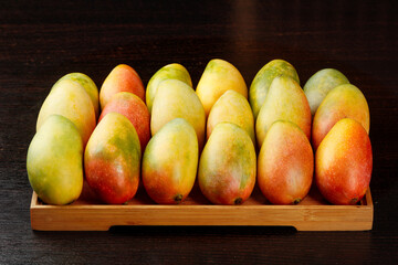 Tree-Ripened Guifei Mangoes from Hainan China in Wooden Tray Display