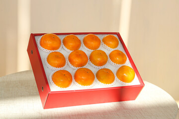 Fresh Fuping persimmons in red gift box - premium fruit packaging and presentation