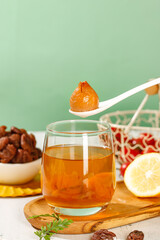 Chinese Lychee Honey Tea with Dried Fruits and Cinnamon Spices on Wooden Board
