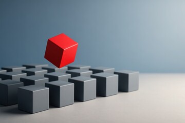 Red cube floating above uniform gray cubes on neutral background symbolizing leadership individuality innovation and standing out concepts