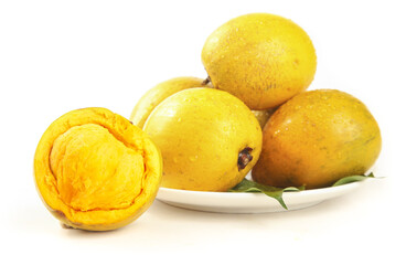 Fresh Egg Fruit with Creamy Yellow Flesh on White Plate - Tropical Canistel Fruit