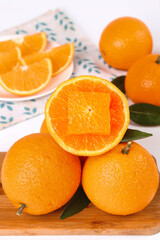 Fresh Orange Citrus Fruits Sliced on Wooden Board Natural Light Food Photography