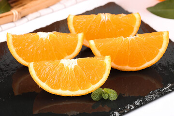 Fresh Orange Slices on Slate Plate with Mint Garnish - Healthy Citrus Fruit Photography