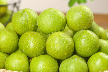 Fresh Green Sichuan Plums with Water Droplets - Healthy Organic Stone Fruit