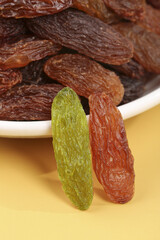 Two-Color Xinjiang Raisins Combination - Green and Red Dried Grapes on Light Background