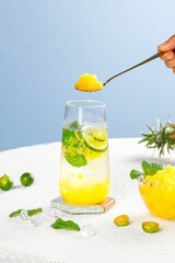 Fresh Pineapple Cocktail with Granita Topping and Mint Garnish on Marble Counter