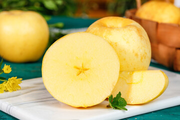 Fresh Venus Apple Slices with Cream Flesh on Marble Cutting Board