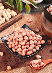 Fresh Raw Peanuts in Bowl on Wooden Kitchen Surface - Healthy Snack Food Ingredient