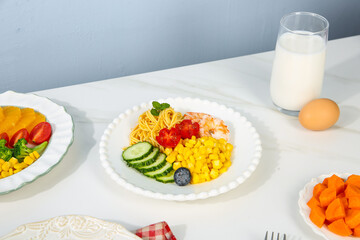 Fresh Gourmet Prawn Salad with Corn Kernels and Mixed Greens on White Marble Table