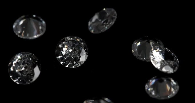 Jewelry zirconia stones on a dark background. Artificial zirconium stone is picked up with tweezers.