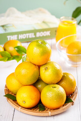 Fresh Orange Citrus Fruits in Basket with Juice Glass Summer Healthy Food Concept