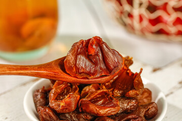 Dried Lychee Fruit Wei Gui Traditional Chinese Fukien Preserved Sweet Snack on Wooden Spoon