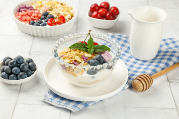 Healthy oat breakfast bowl with berries yogurt and honey morning meal