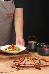 Sichuan Smoked Bacon and Vegetables Traditional Chinese Cuisine Preparation on Wood Table