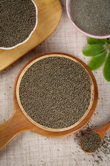 Organic Green Mung Beans and Grains in Wooden Bowls on Rustic Burlap Background