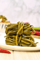 Pickled Green Beans on White Plate - Traditional Preserved Vegetable Cuisine
