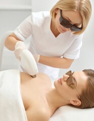 Obraz premium Laser hair removal treatment on a woman's body.