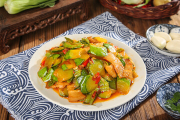Asian Stir Fry Vegetables with Pumpkin and Peppers in Deep Savory Sauce on Traditional Blue White Plate