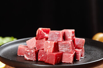 Raw Beef Cubes Diced on Black Plate - Fresh Red Meat Cuts for Cooking