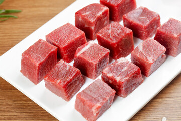 Fresh Diced Australian Beef Cubes Cut Raw Red Meat on White Board Ready for Cooking