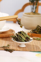 Traditional Chinese White Tea Tasting Ceremony with Fuding Baihao Silver Needle Leaves and Bamboo Tools