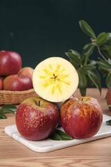 Freshly Cut Red Apples from Yunnan Showing Star Pattern Core on Marble Board