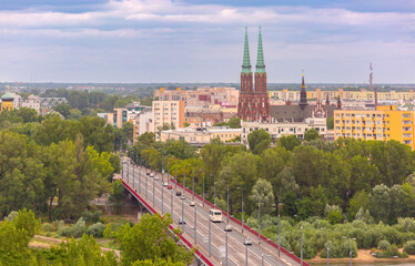 Bridge leading to Praga District in Warsaw, Poland, with Saints Michael and Florian Cathedral and apartment buildings in background