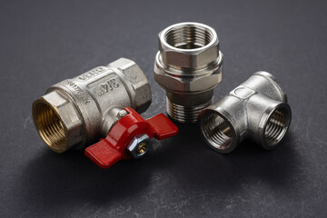 water ball valve with connecting fitting, on dark background