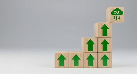 Carbon footprint reduction concept with wooden blocks and green arrows rising up