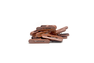 Brown Plastic Clips on Plain White Background