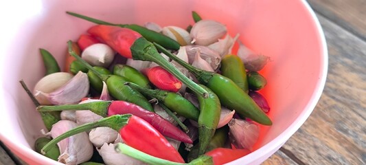 Chili and garlic in a pink bowl on the dining table