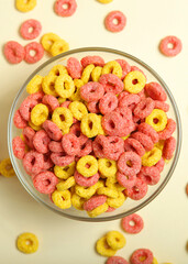 colored corn rings for breakfast on the table close-up. Vertical photo format