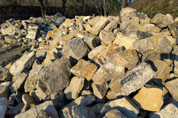 Mountains of construction materials for building, paving, and road repairs.