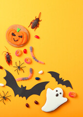 Halloween background with gingerbread and other sweets with place for text. Vertical photo format